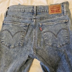 Levi supper skinny jeans medium wash size 24